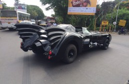 Batman takes his Batmobile for a spin