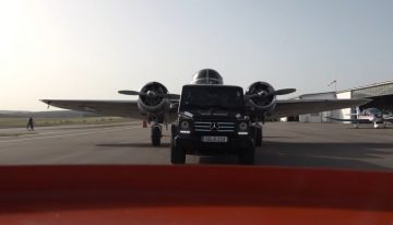 Mercedes-Benz G-Class fights Land Rover Defender pulling a WWII bomber